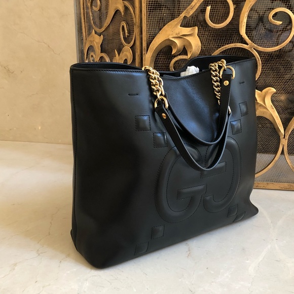 Gucci Handbags - NWT Gucci GG embossed leather tote handbag black